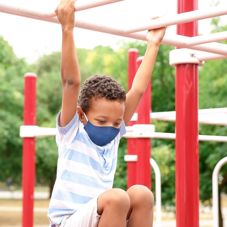 wearing cloth face mask at a playground